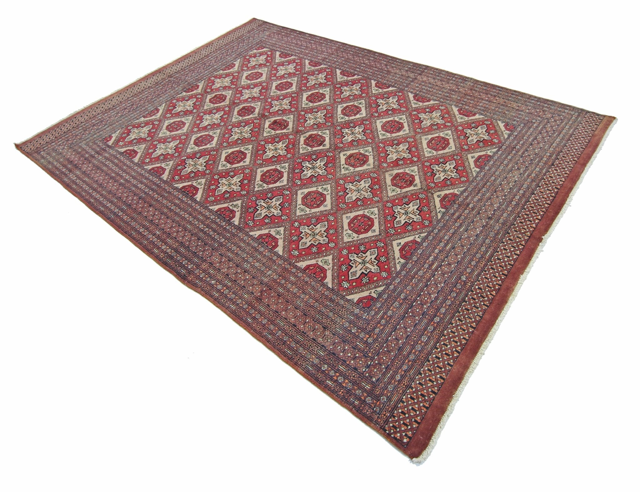 A vintage Pakistani Princess Bokhara rug featuring a red diamond pattern on a wool pile.