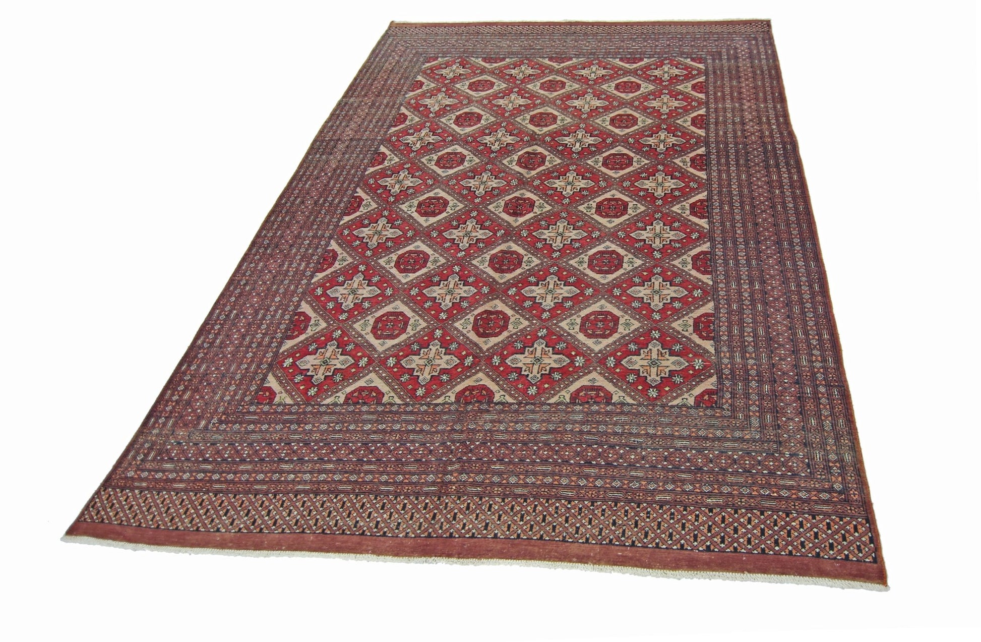 A vintage Pakistani Princess Bokhara rug featuring a red geometric pattern on a wool pile.
