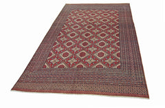 A vintage Pakistani Princess Bokhara rug featuring a red geometric pattern on a wool pile.