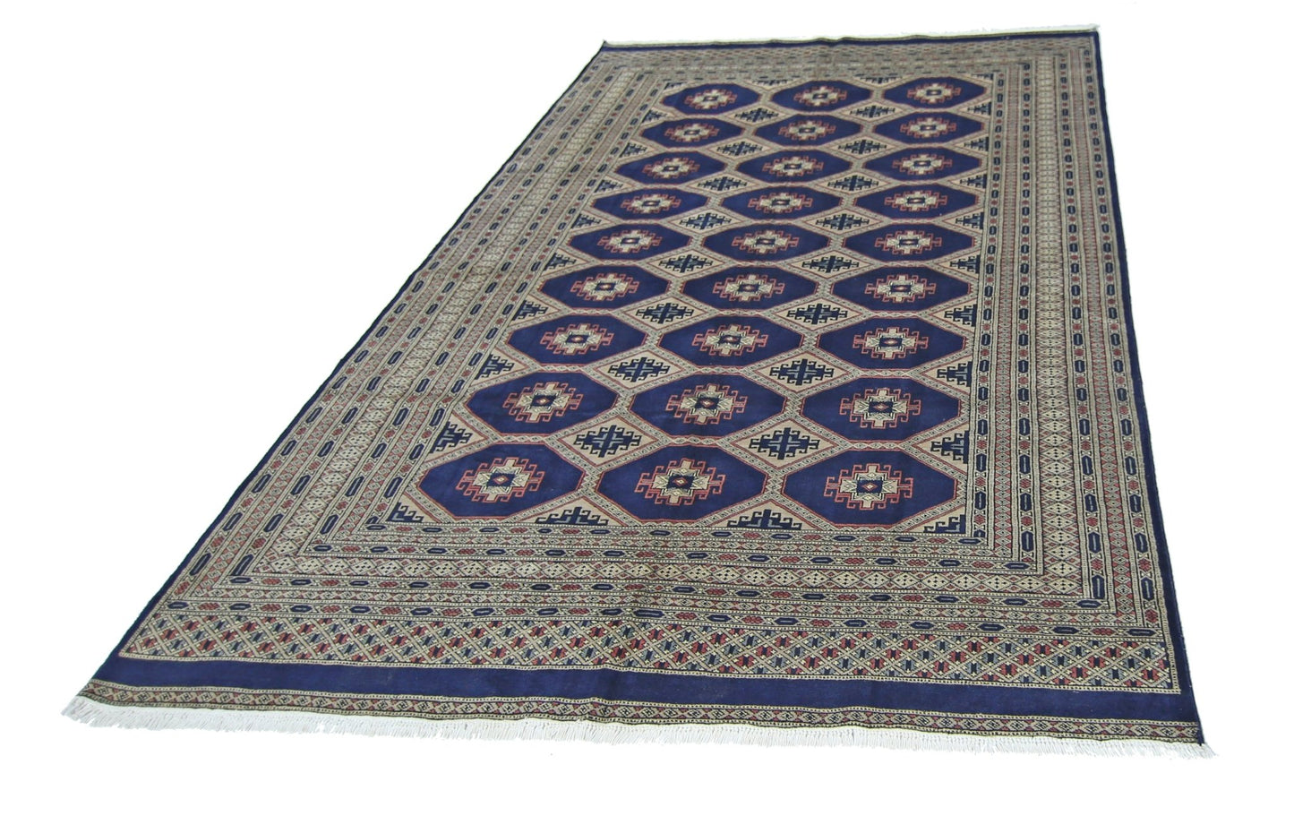 A vintage Pakistani Princess Bokhara rug featuring a repeating diamond pattern in deep blue.