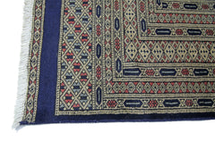 A vintage Pakistani Princess Bokhara rug featuring intricate geometric patterns in red and blue.