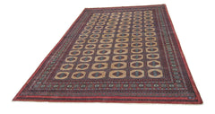 A vintage Pakistani Princess Bokhara rug featuring a repeating geometric pattern on a red field.