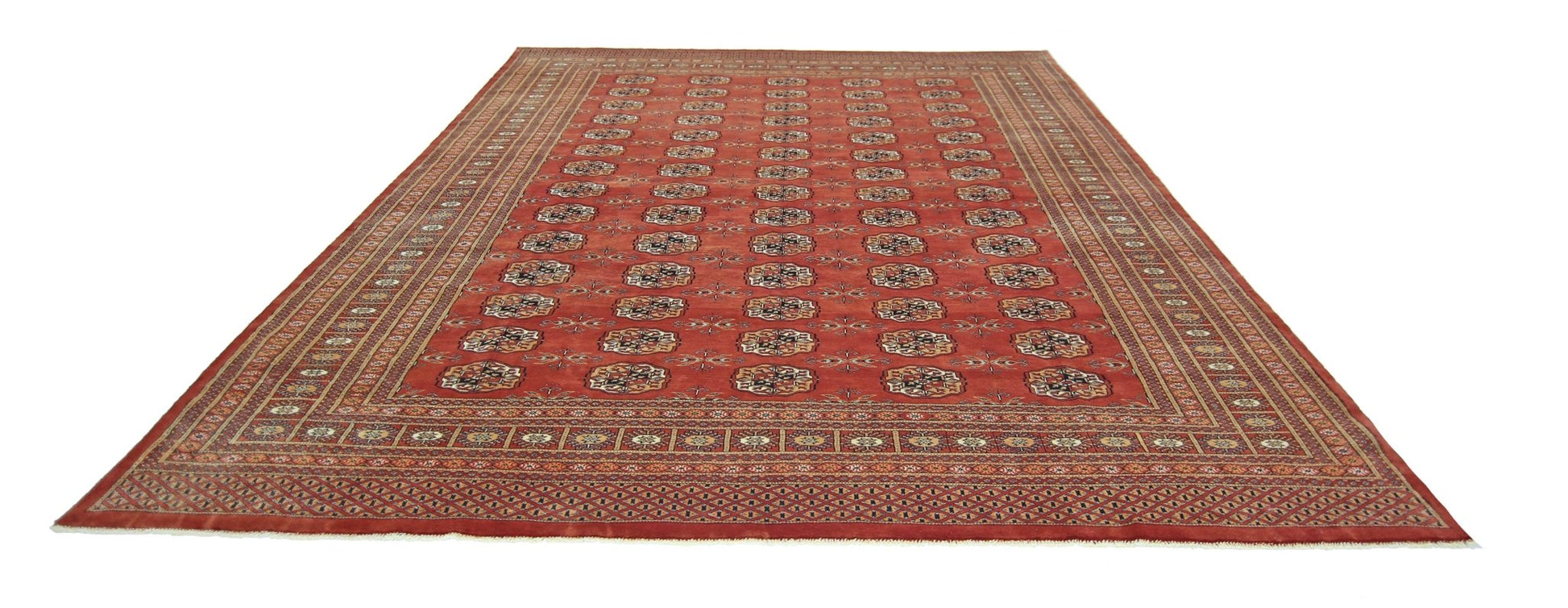 A vintage Pakistani Princess Bokhara rug featuring a repeating geometric pattern on a red field.
