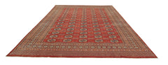 A vintage Pakistani Princess Bokhara rug featuring a repeating geometric pattern on a red field.