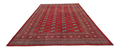 A vintage Pakistani Princess Bokhara rug featuring a repeating geometric pattern in deep red.