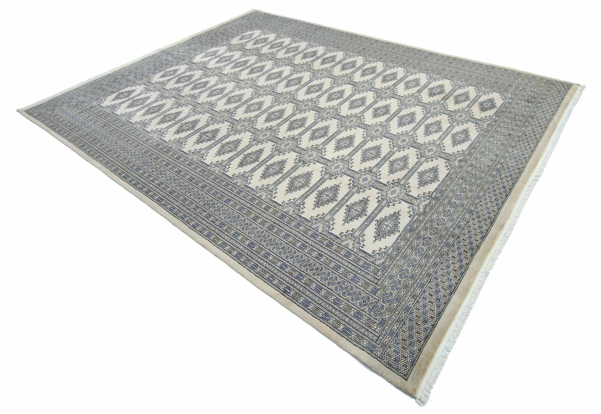 A vintage Pakistani Princess Bokhara rug featuring a repeating geometric pattern in blue and cream.