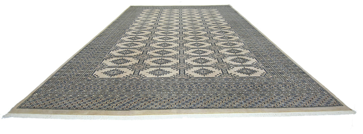 A vintage Pakistani Princess Bokhara rug featuring a repeating geometric pattern in wool.