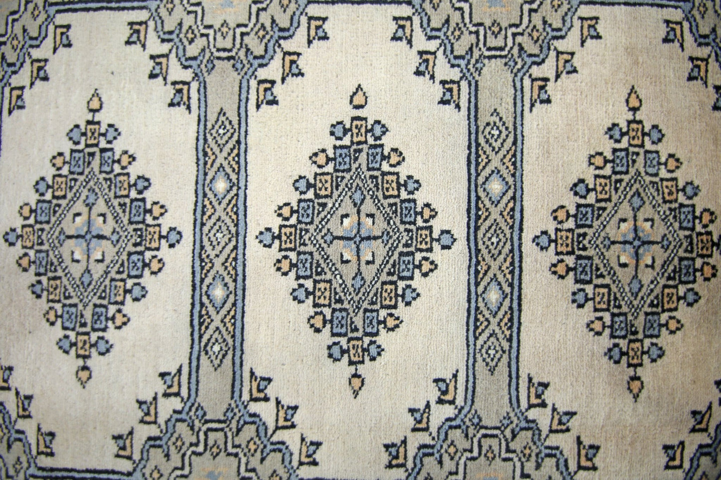 Vintage Pakistani Princess Bokhara rug featuring repeating diamond motifs in blue and beige.