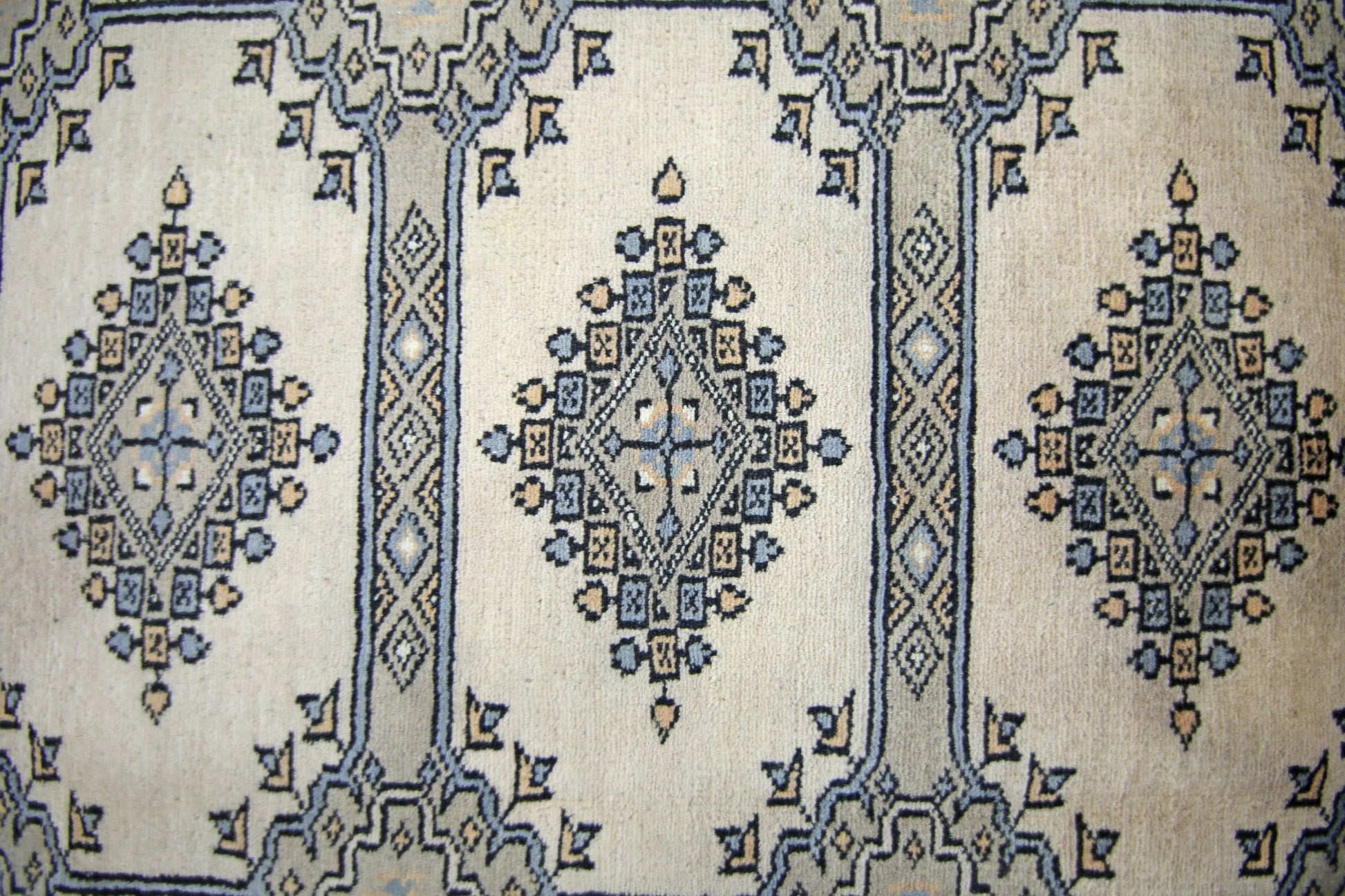 Vintage Pakistani Princess Bokhara rug featuring repeating diamond motifs in blue and beige.
