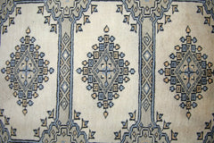 Vintage Pakistani Princess Bokhara rug featuring repeating diamond motifs in blue and beige.