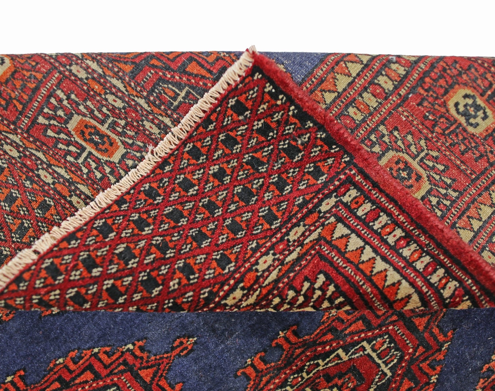 A vintage Pakistani Princess Bokhara rug featuring a geometric red and black pattern.