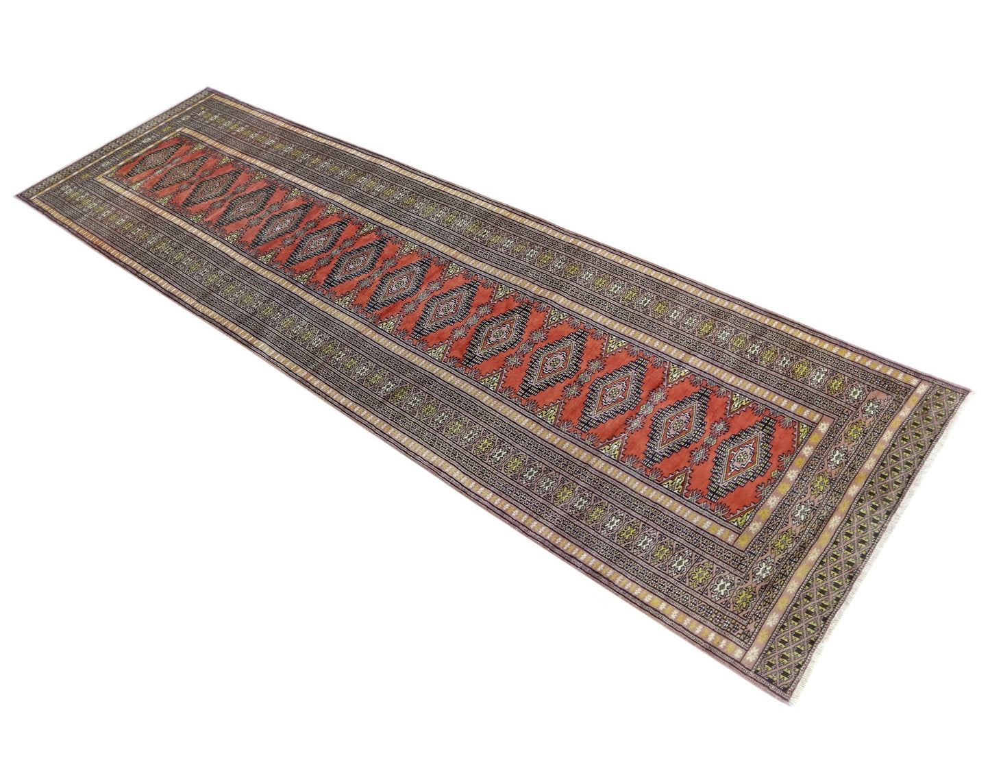 A vintage Pakistani Princess Bokhara runner featuring a repeating diamond pattern in red and black.