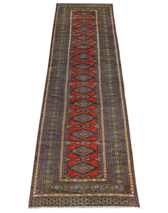 A vintage Pakistani Princess Bokhara runner featuring repeating diamond motifs on a red background.