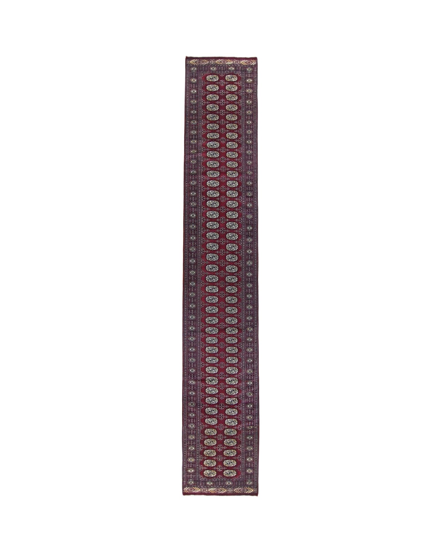 A vintage Pakistani Princess Bokhara runner featuring a deep red field with repeating oval motifs.