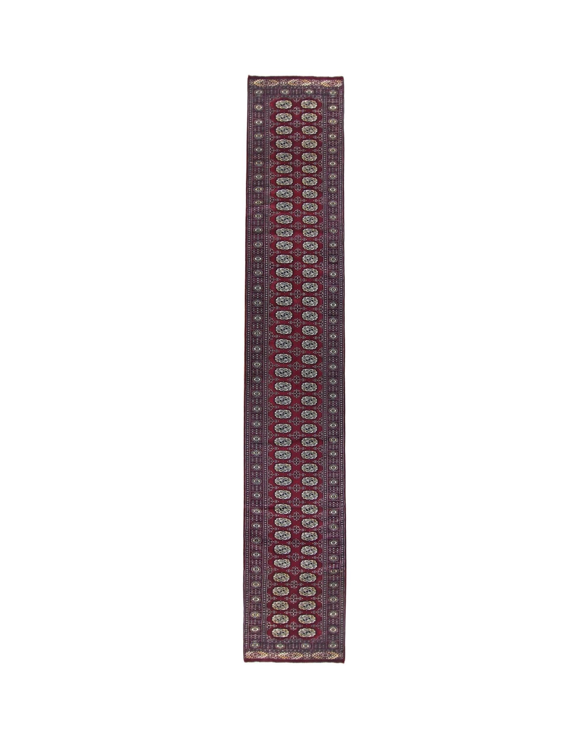 A vintage Pakistani Princess Bokhara runner featuring a deep red field with repeating oval motifs.