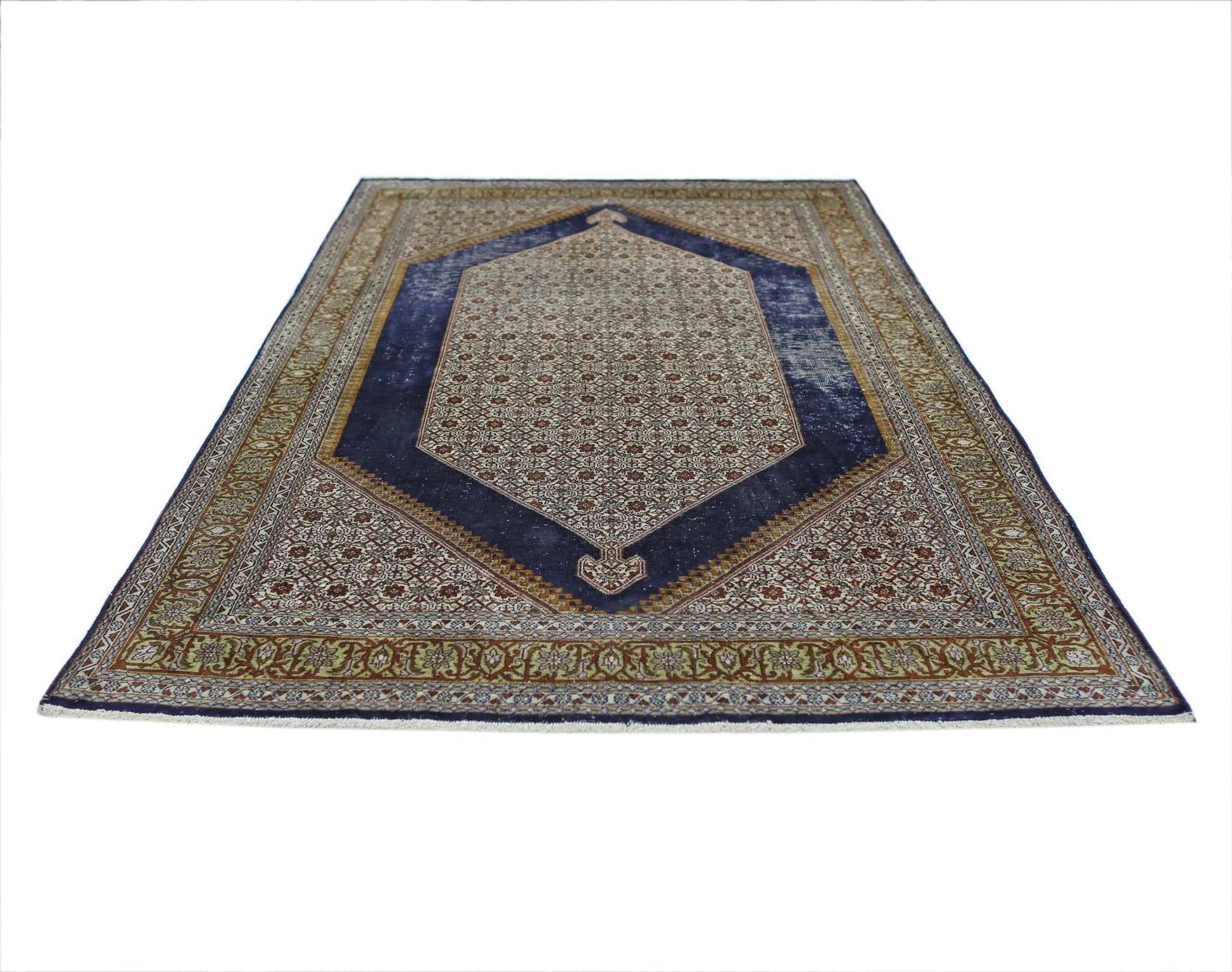 A vintage handmade Kashmiri silk rug featuring a central blue medallion and intricate floral motifs.