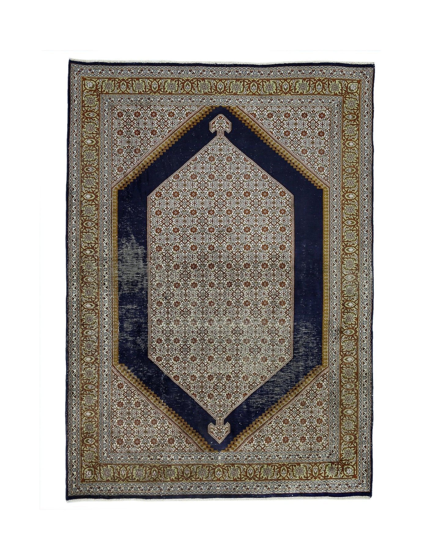 A vintage handmade Kashmiri silk rug featuring a central floral medallion on a dark blue field.