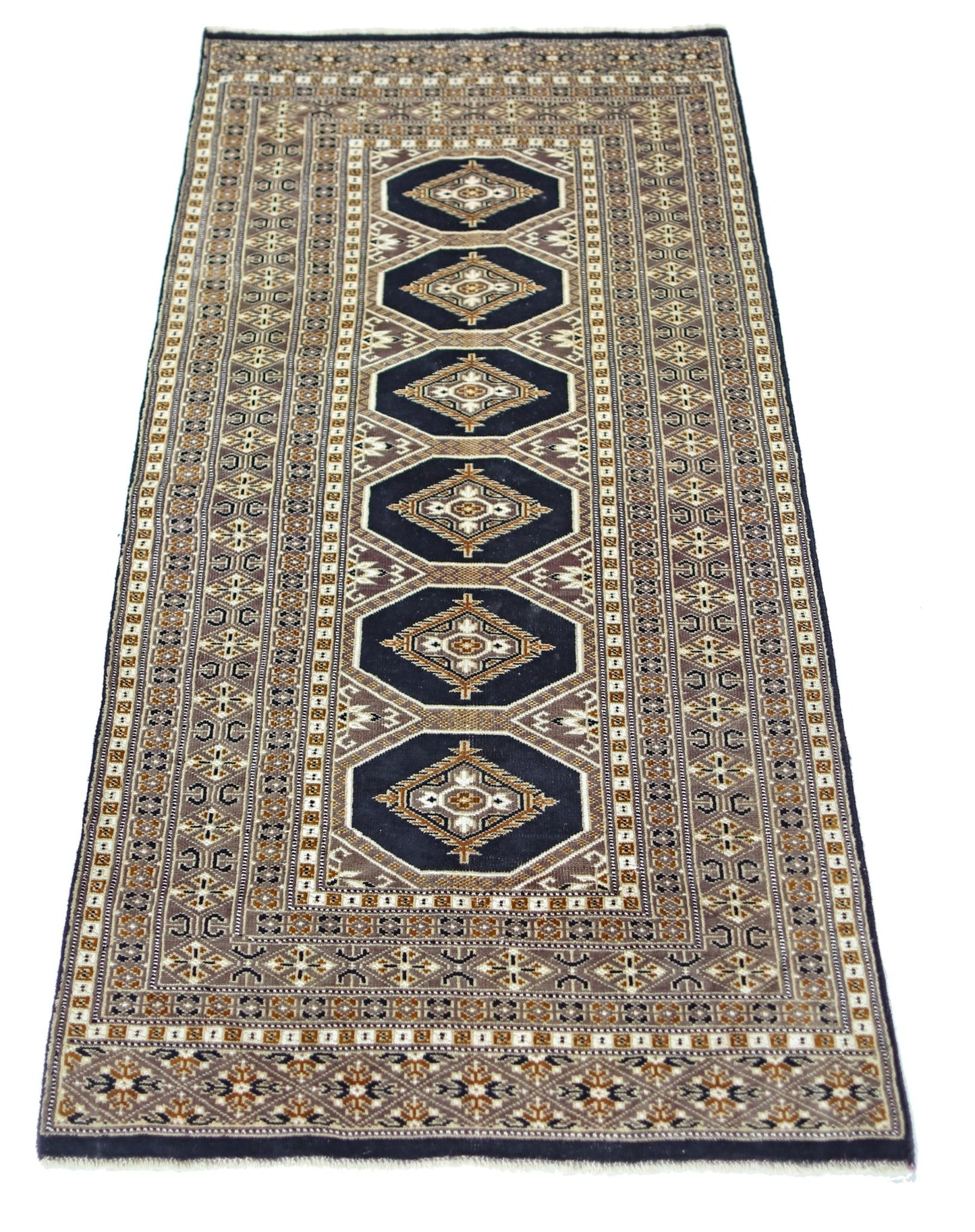 A vintage Pakistani Princess Bokhara runner rug featuring repeating geometric medallions in dark blue.