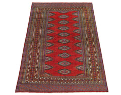 A vintage Pakistani Princess Bokhara rug featuring a red field with repeating geometric motifs.
