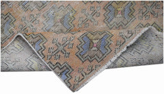A vintage handwoven Turkish Isparta runner featuring geometric patterns in orange and blue tones.