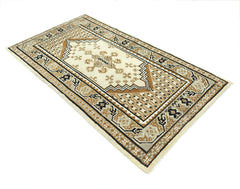 A handwoven Afghan rug featuring a geometric tribal pattern in shades of cream, brown, and black.