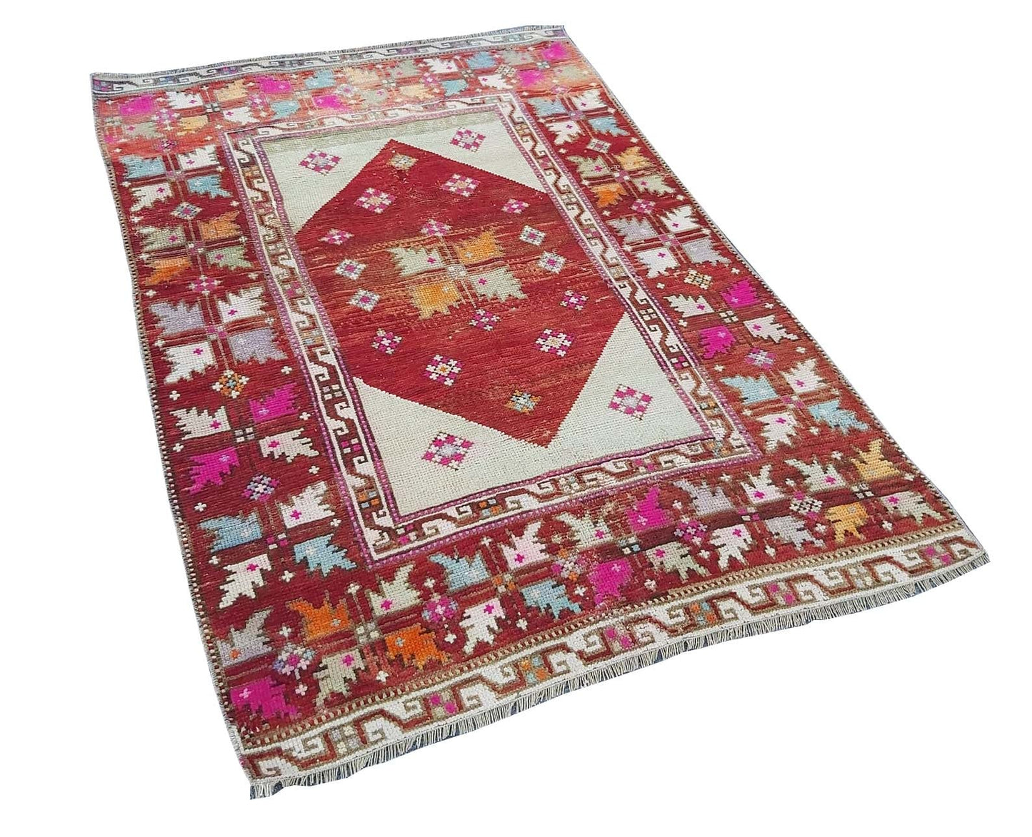 A vintage handmade Turkish Kula rug featuring a red diamond medallion and colorful geometric motifs.