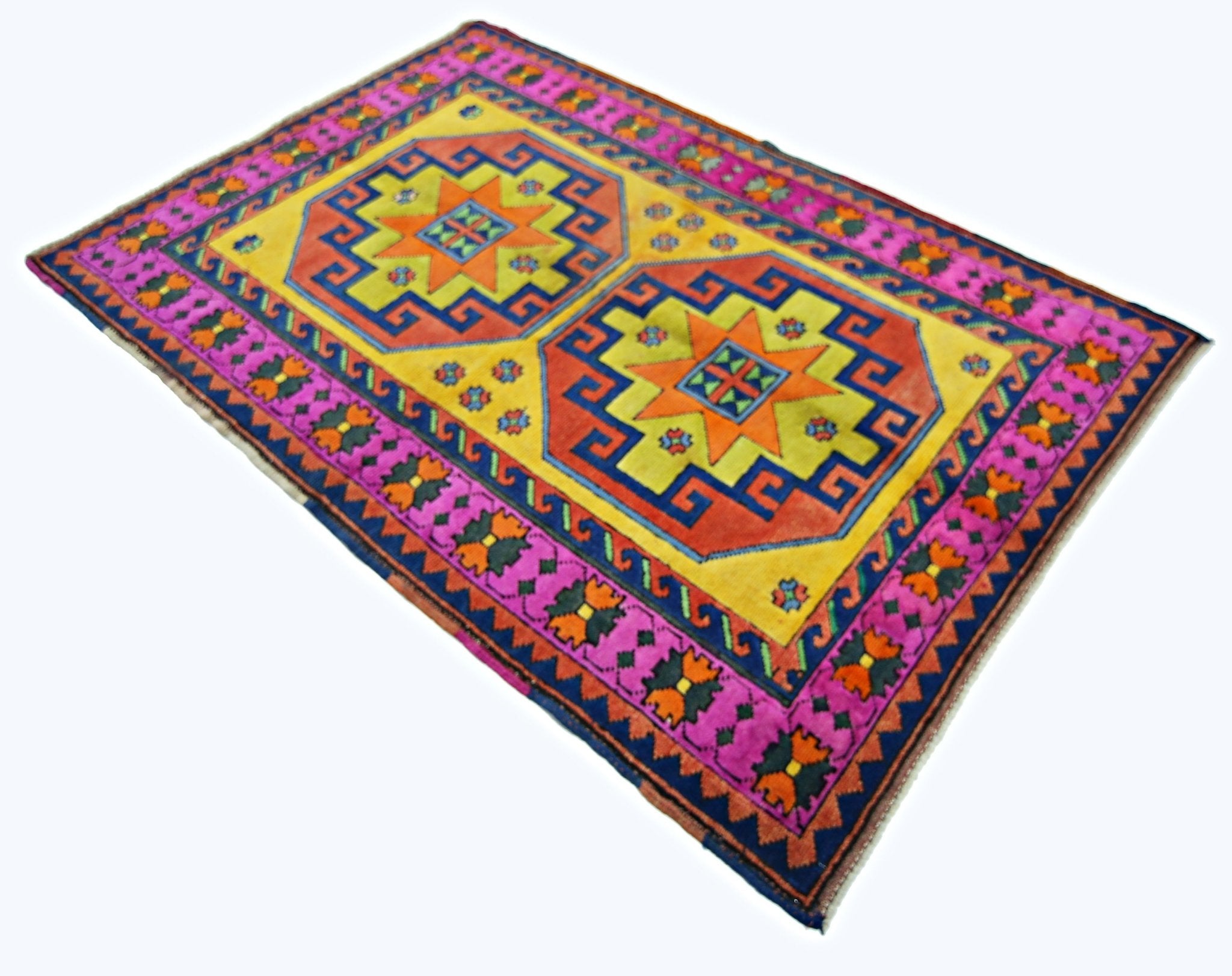 A handmade vintage Turkish rug featuring two geometric star medallions on a vibrant yellow field.