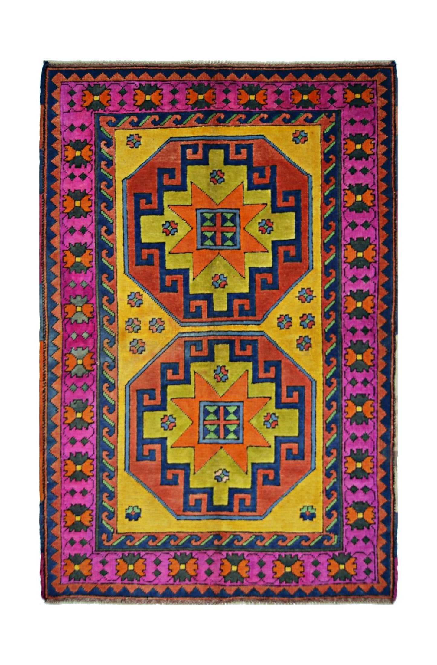 A vintage handmade Turkish rug featuring two geometric medallions on a vibrant yellow background.