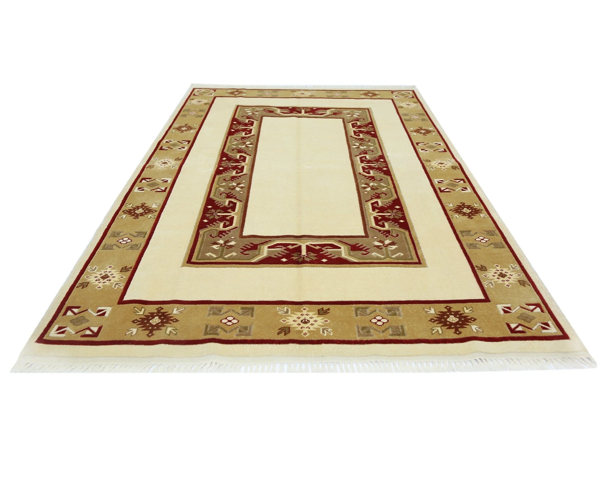 A vintage handmade Turkish Milas rug featuring a cream center with a geometric red and tan border.