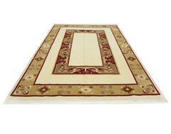 A vintage handmade Turkish Milas rug featuring a cream center with a geometric red and tan border.