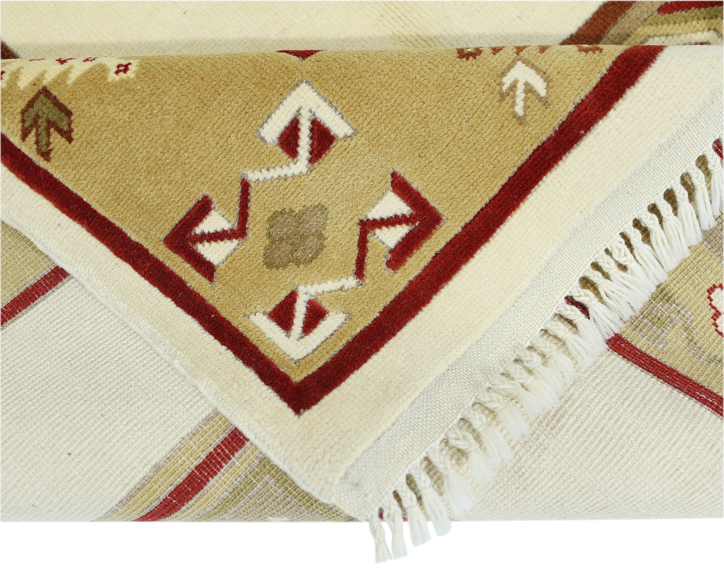 A vintage handmade Turkish Milas rug featuring geometric patterns in red, beige, and cream.