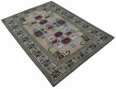 A vintage handmade Turkish Oushak rug featuring a traditional spreading pattern in a neutral tone.