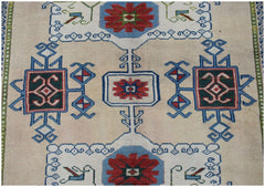 A vintage Turkish Oushak rug featuring a traditional geometric pattern in red, blue, and green.