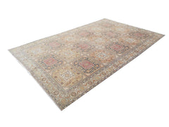 A vintage handmade Turkish Oushak rug featuring a repeating geometric medallion pattern in wool.