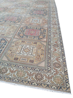 A vintage Turkish Oushak rug featuring a geometric grid pattern in muted earth tones.