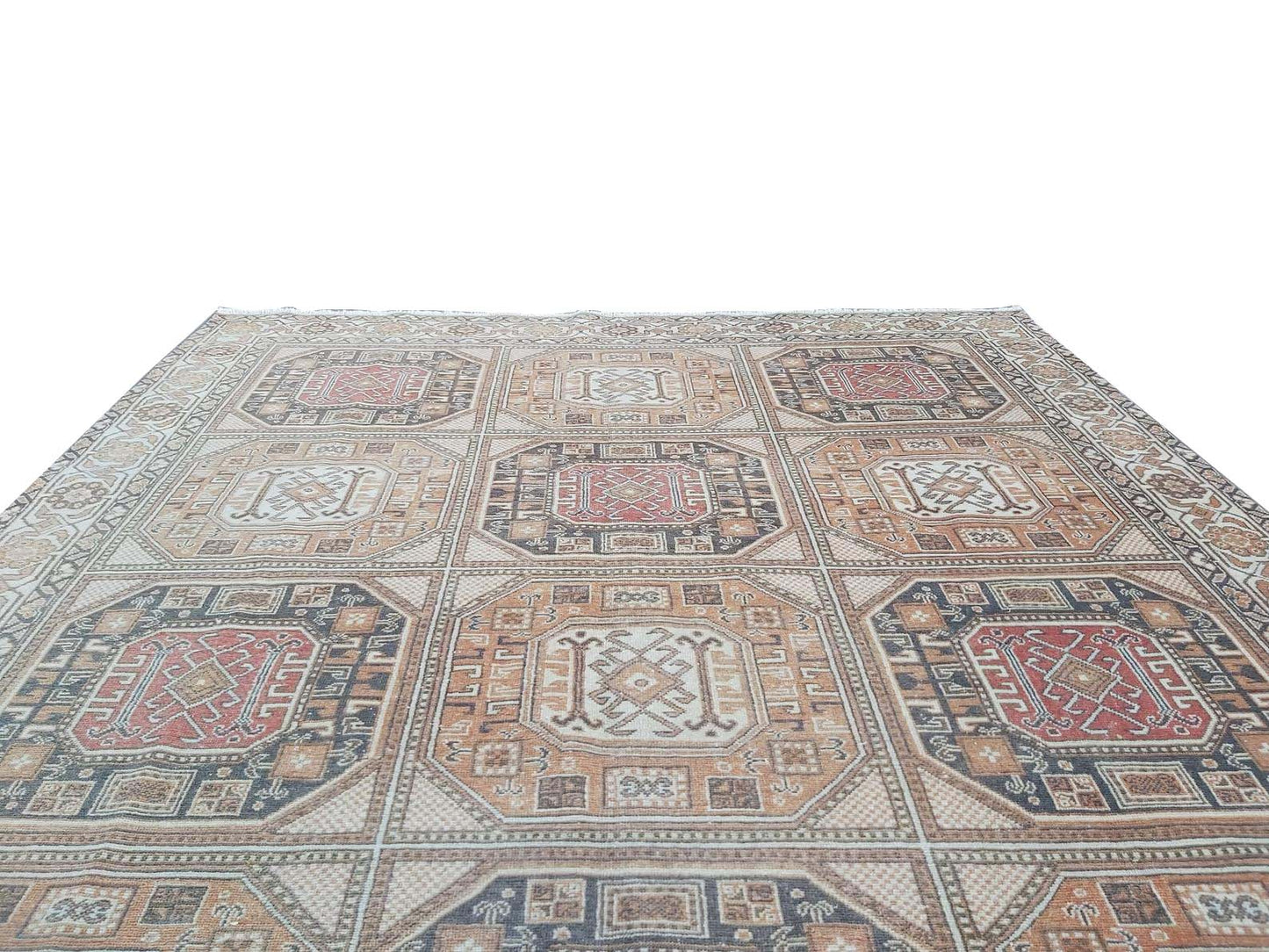A vintage handmade Turkish Oushak rug featuring a geometric grid of octagonal medallions.