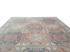 A vintage handmade Turkish Oushak rug featuring a geometric grid of octagonal medallions.