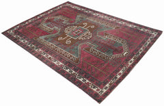 A vintage handwoven Iranian rug featuring geometric patterns in shades of red, brown, and green.