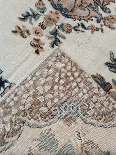 A vintage Turkish Isparta rug with a floral pattern and a textured, three-dimensional effect.