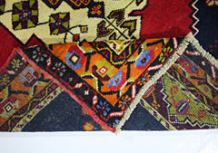 A vintage handmade Turkish Taspinar rug featuring intricate geometric patterns in vibrant colors.
