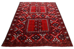 A handwoven vintage Afghan Turkmen Engsi rug featuring a red field with geometric tribal motifs.