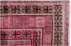 An antique handwoven Afghan rug featuring an intricate pomegranate pattern in vibrant pink.