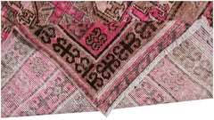 A handwoven antique Afghan Turkmen rug featuring an intricate pomegranate pattern in vibrant pink.