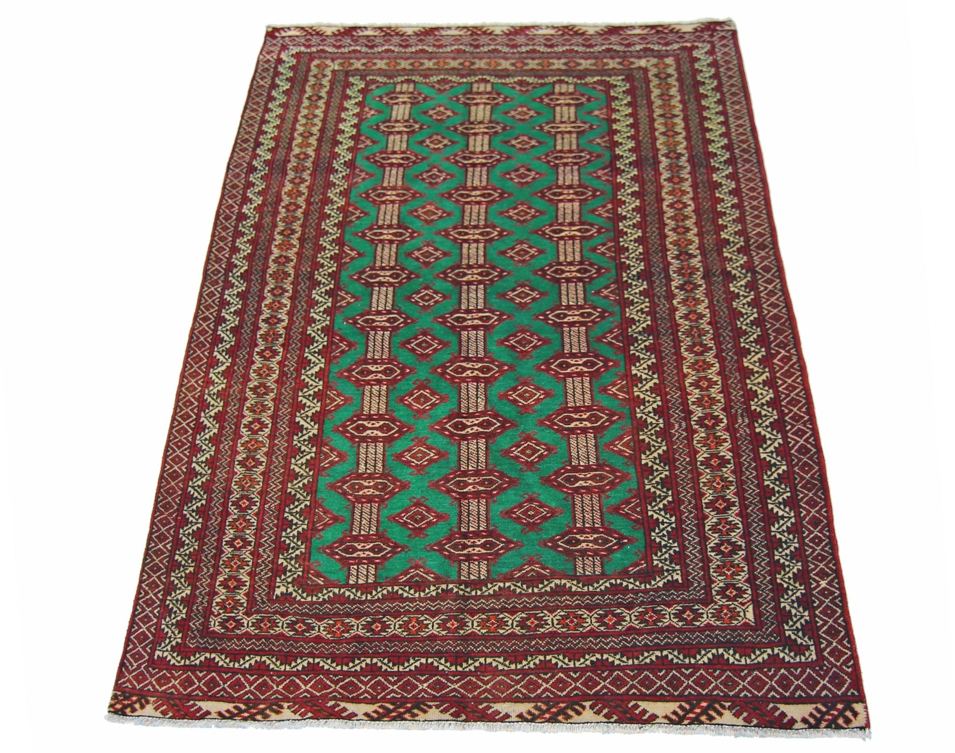 A vintage Persian Turkmen rug featuring a repeating diamond pattern in red and green.