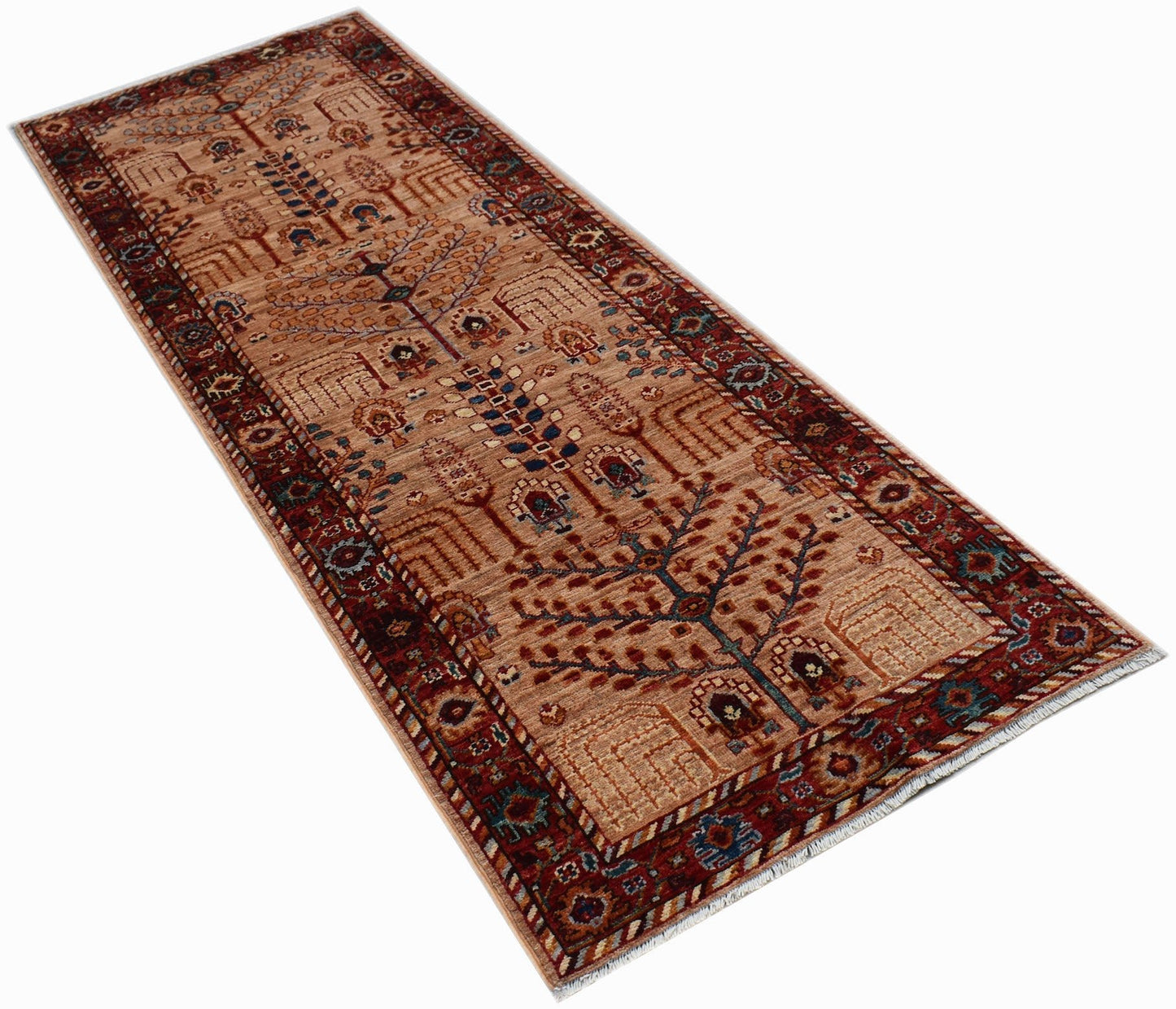 A handmade Afghan Chobi runner rug featuring a traditional tree of life pattern in earthy tones.