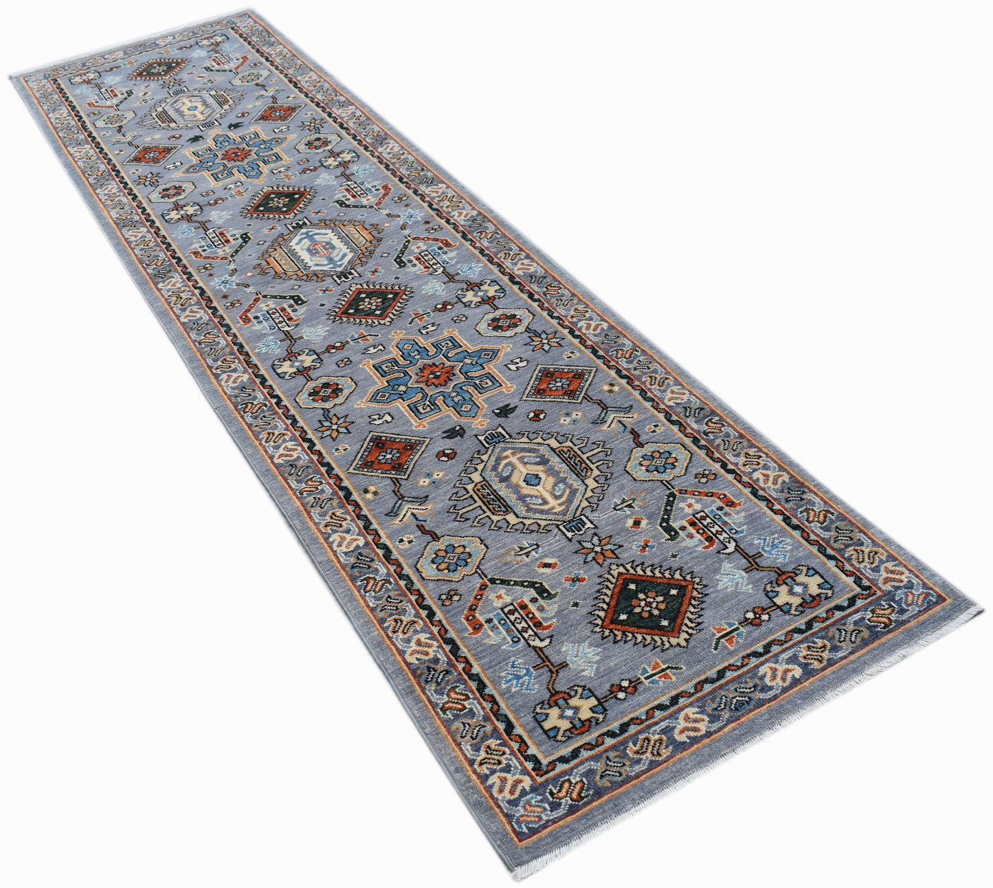 A hand-knotted Afghan Chobi runner rug featuring traditional geometric patterns in blue tones.