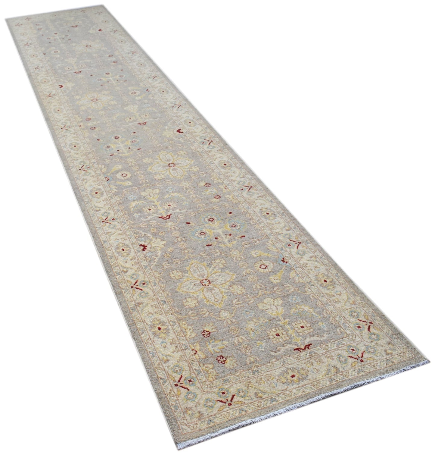 An Afghan Chobi runner rug featuring a traditional floral pattern in soft beige and grey tones.