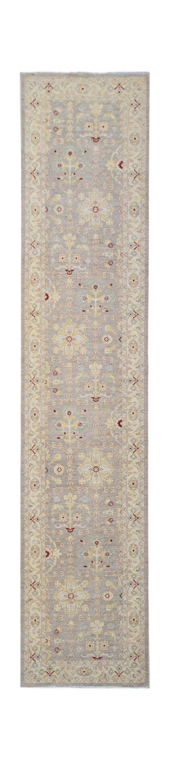 A hand-knotted Afghan Chobi runner featuring a traditional floral pattern in soft, earthy tones.