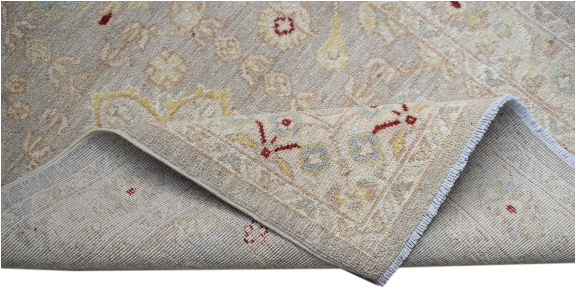 A hand-knotted Afghan Chobi runner featuring a traditional floral pattern in soft neutral tones.