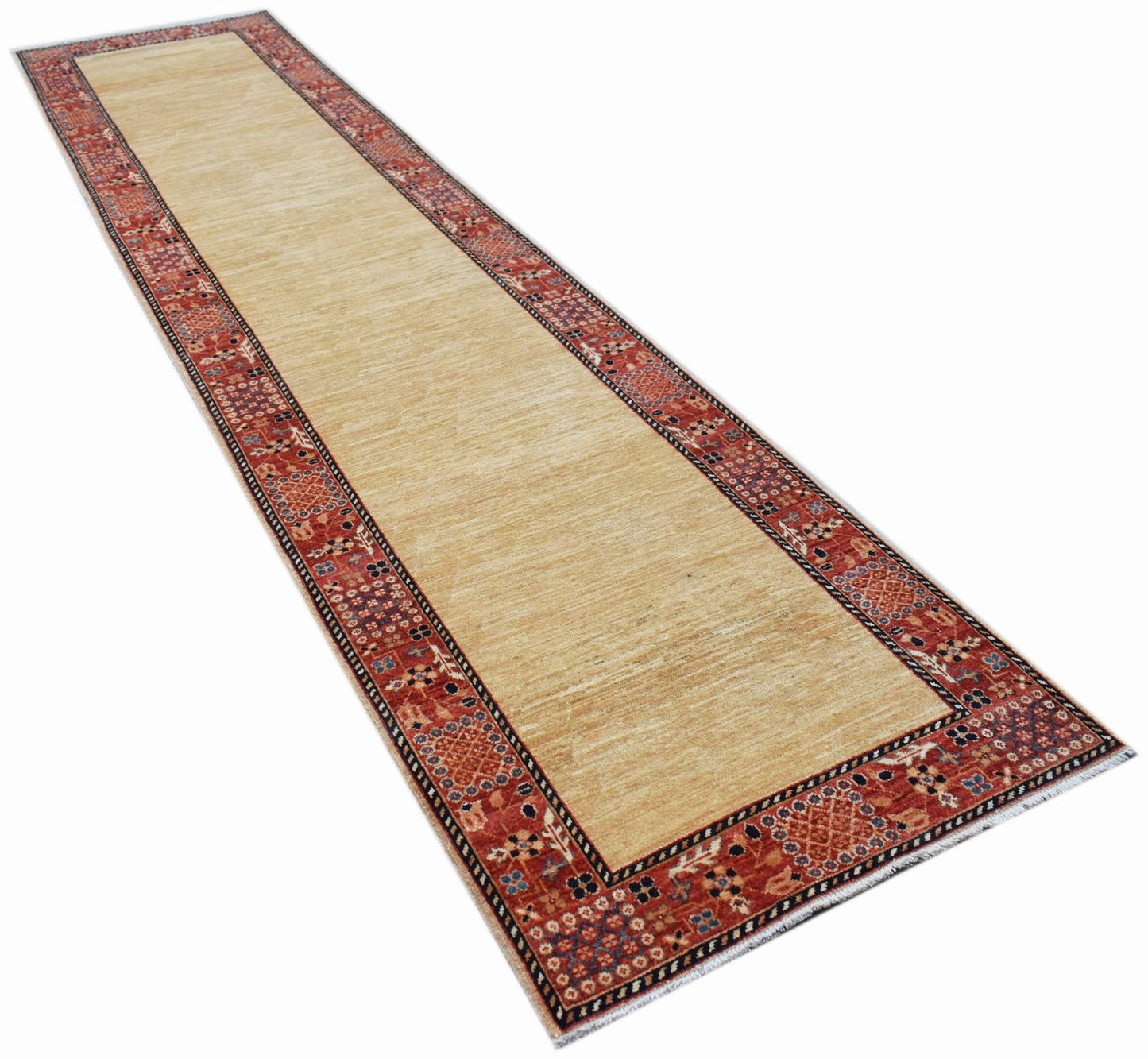 A long, handmade Afghan Chobi runner rug featuring a beige field and a patterned red border.